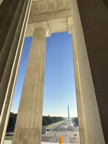 View of the Washington Monument between the Lincoln Memorial columns