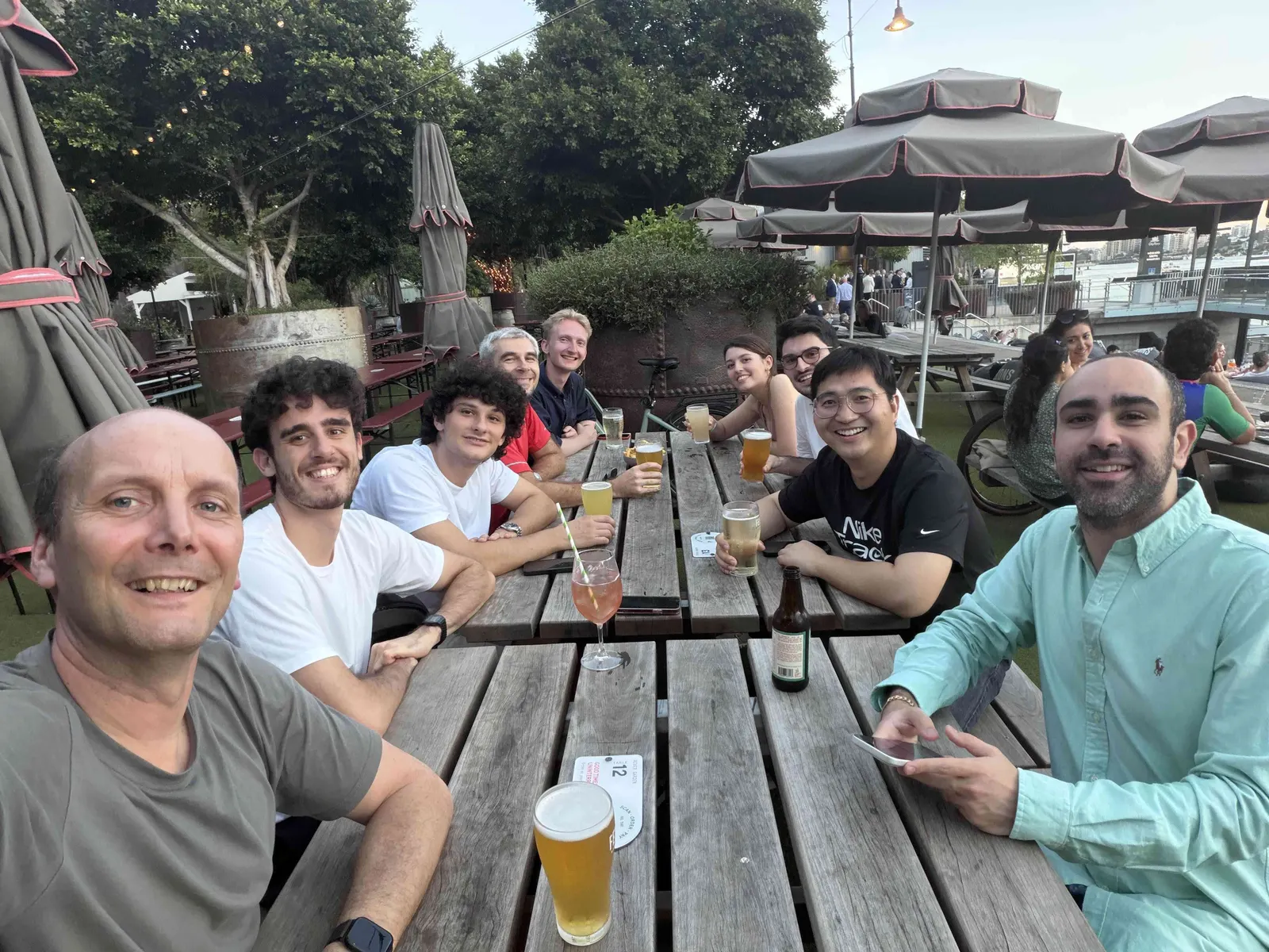 Lab members taking a selfie at an outdoor beer garden