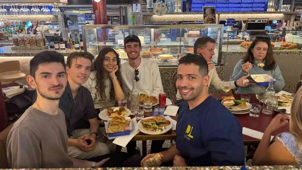 Lab members sharing a meal at a food court