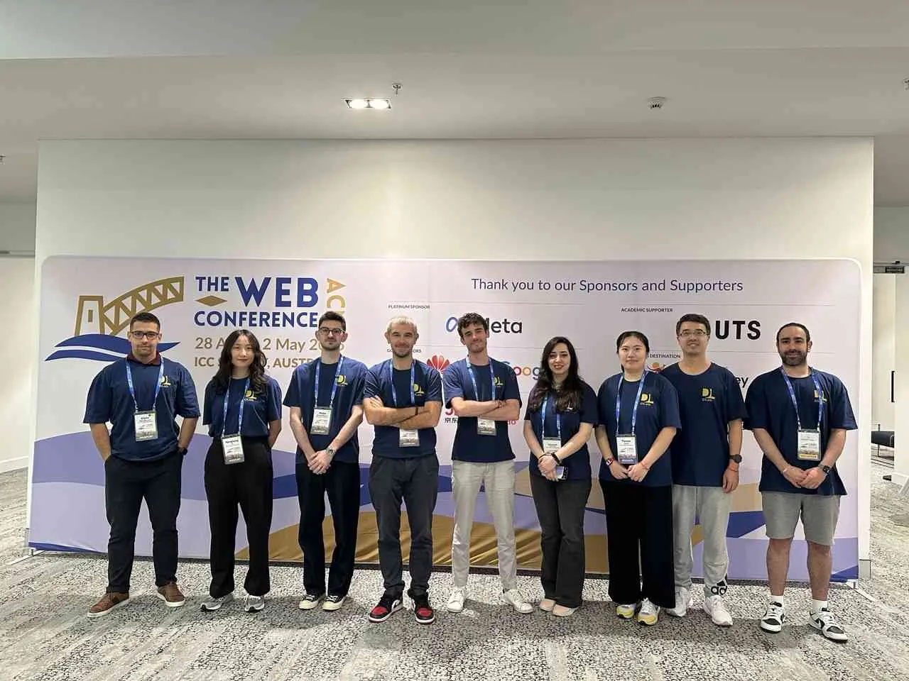 DLab members in matching lab shirts at The Web Conference