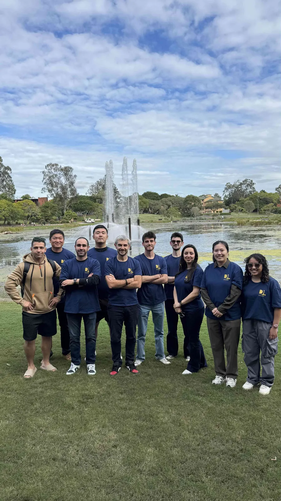 DLab members in lab shirts by the lake at The University of Queensland